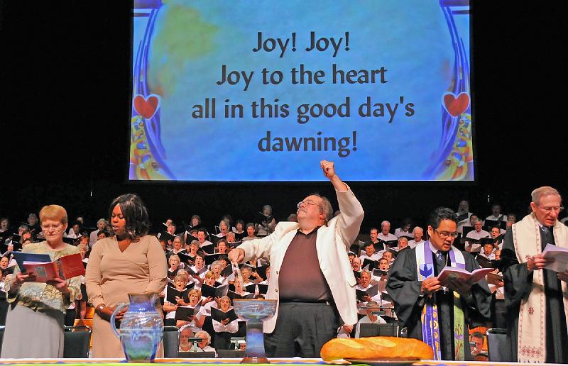 19 - Worship at Event Center.jpg - Maestro Leroy Kromm directs the choir at the San Jose State University Event Center.  Again, many Stone Church members were in the choir that day.